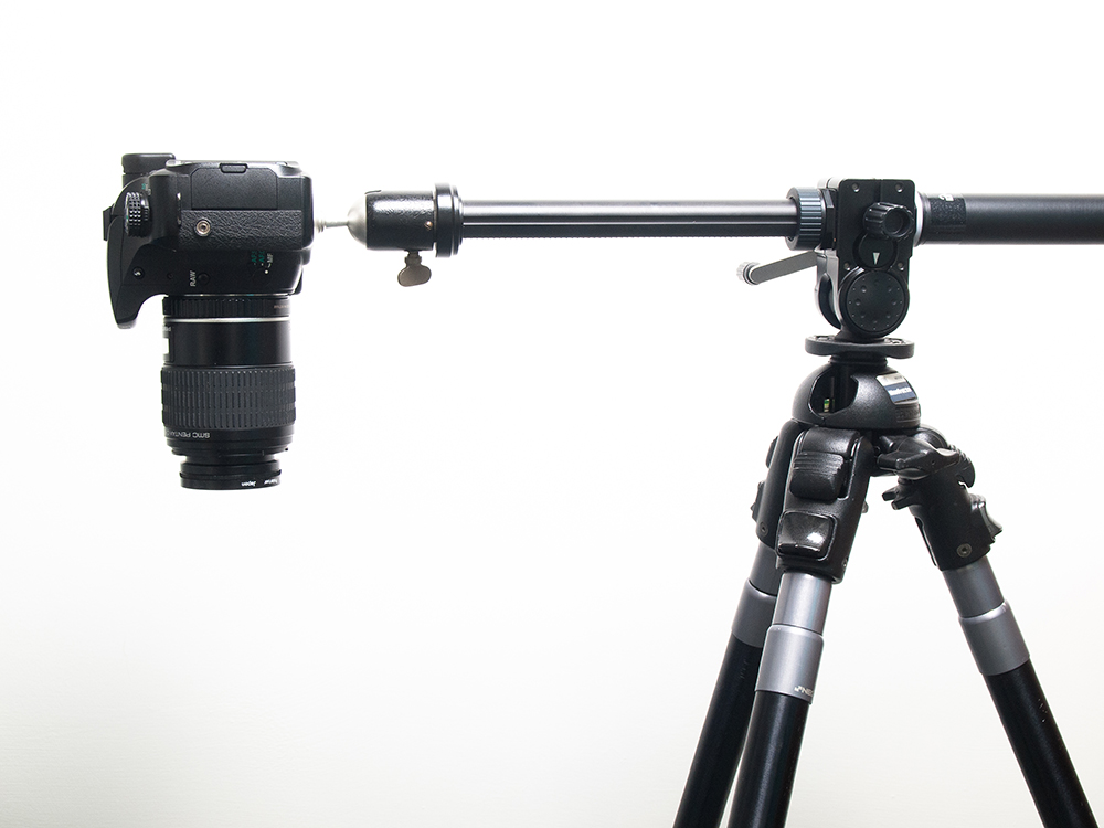 A digital camera on a tripod arm, an essential part of every professiona food photographer's food photography equipment