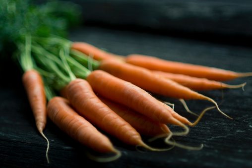 A selective focus photograph of carrots illustrating the best lens for food photography
