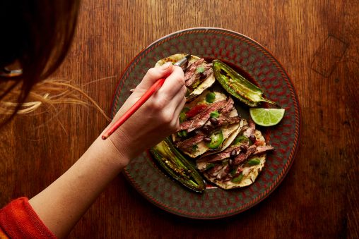 A food stylist demonstrates one of her food styling tricks using a brush